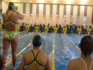 Photo by Jack Kaup. Swimmers prepare moments before entering the water. Elk Grove hosted an invite over the weekend giving the team a chance to step up.