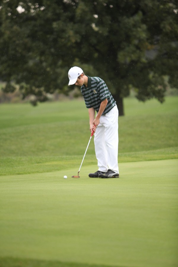 Photo by Joe Gonzalez.
Senior Connor Laughlin putts at a recent tournament. The golf team has done well this year. Junior Jordan Guerrero shot a 79 and earned All-Conference at the MSL Conference tournament in Schuamburg on Sept. 30