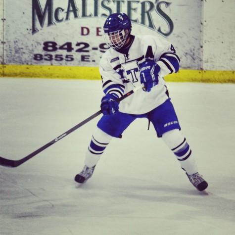 photo by John Bates.
Senior Joey Ritondale helps lead his team to victory by defending the goal. Ritondale dedicates three days a week and weekends to hockey.   