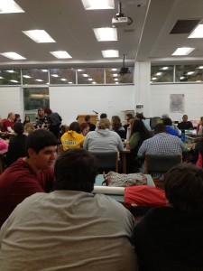 photo by Morgan Loxley. Students gather in the library after school for the poetry slam.