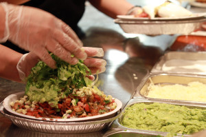 The final touches are added to a Burrito Bowl at a Chipotle restaurant in Chicago, Illinois. (Michael Tercha/Chicago Tribune/MCT)