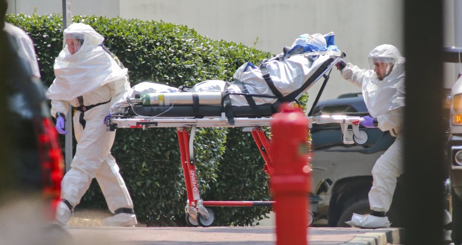 Health Workers wear protective gear as they attend to Ebola victims.