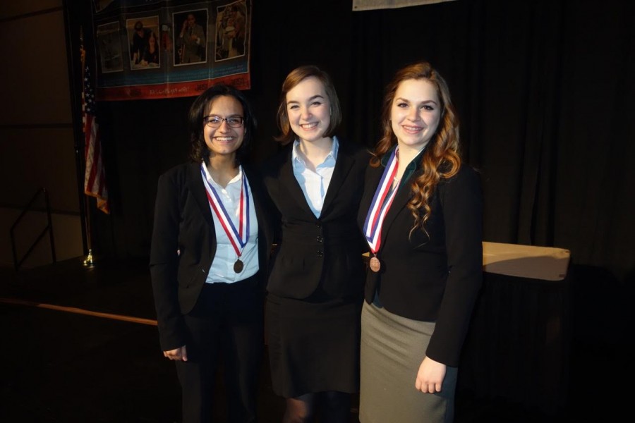 Victory: From left to right, Megan Manoj, Emily Franke, and Kathryn Riopel after the award ceremony at the Peoria Civic Center