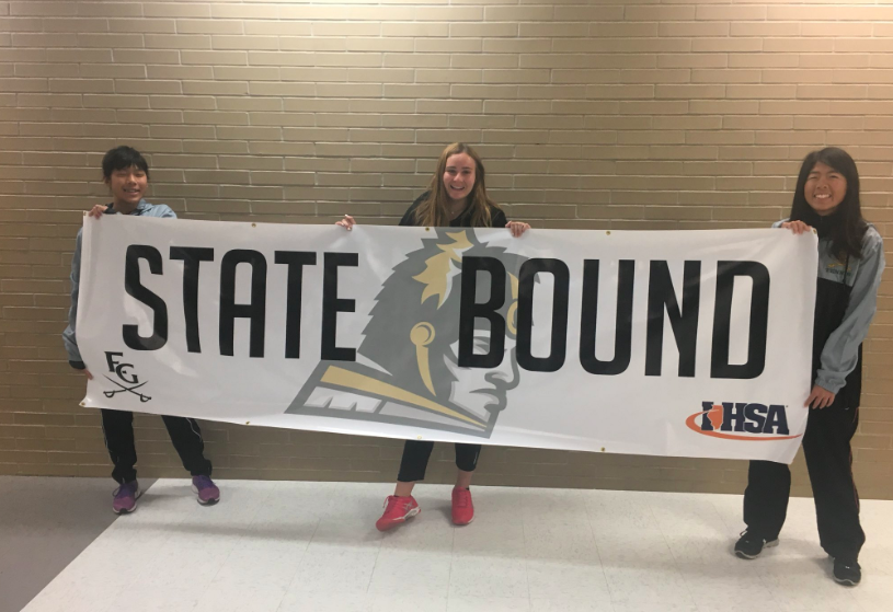 From left to right: Peyton Oda, Jovana Vujanic and Lauren Oda hoist a banner at Elk Grove High School. Photo courtesy of the EGHS Athletics Twitter account.