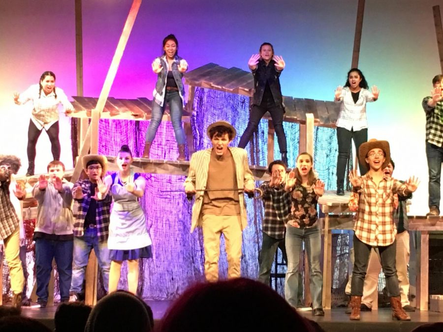 EGHS senior Nick Benjamin (center) portrays the titular character in "Bat Boy" at a show in November. 