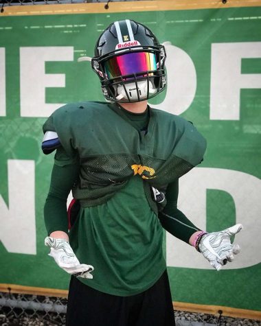 Senior receiver Mark Matos poses with a shrug. Photo courtesy of Thomas Fitzgerald.