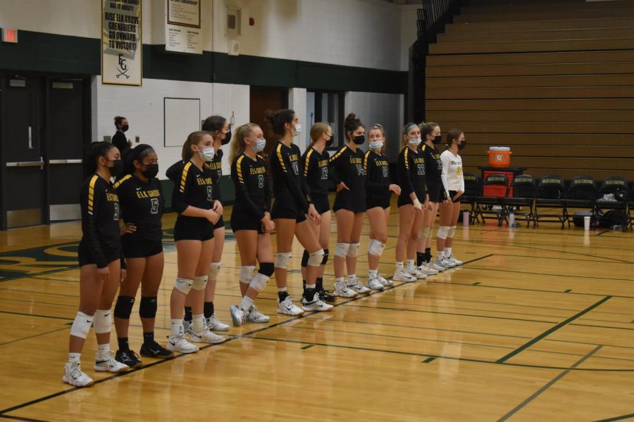 The+girls+volleyball+team+lines+up+before+the+start+of+a+home+game+against+Fremd+High+School