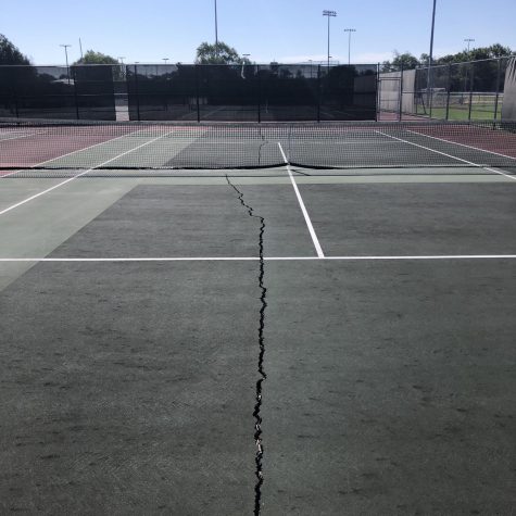 A crack down the middle of one of Elk Groves tennis courts.