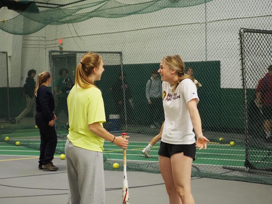 Megan Malartsik and teammate, Lexi Goeringer, bring positive energy to their indoor practice  