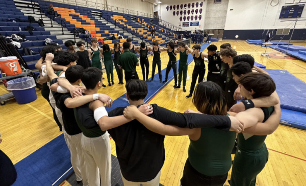 The EGHS boys gymnastics program forms a circle before they warm up for a meet. 
Photo from X (Twitter), via @coach_Diaz1
