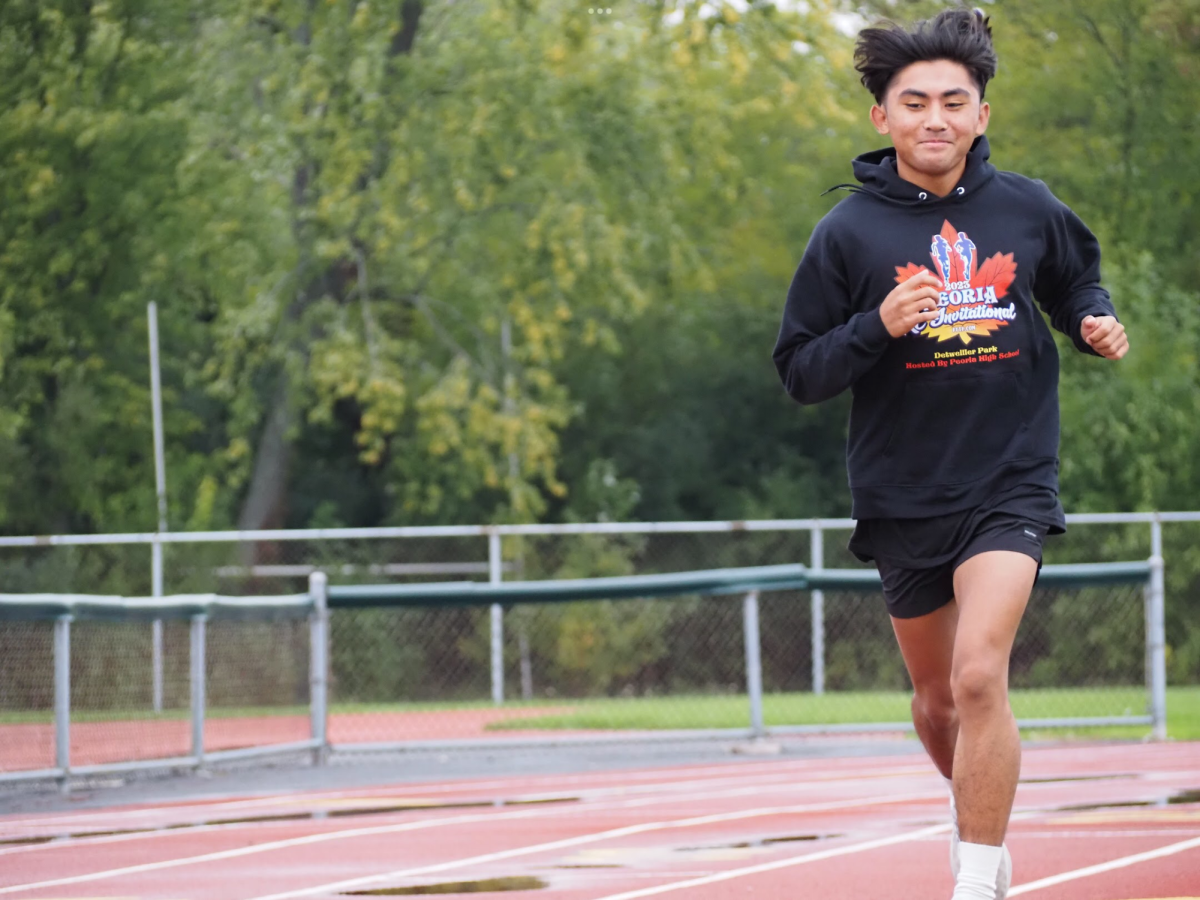 Senior Keane Bayani runs around the EGHS track.