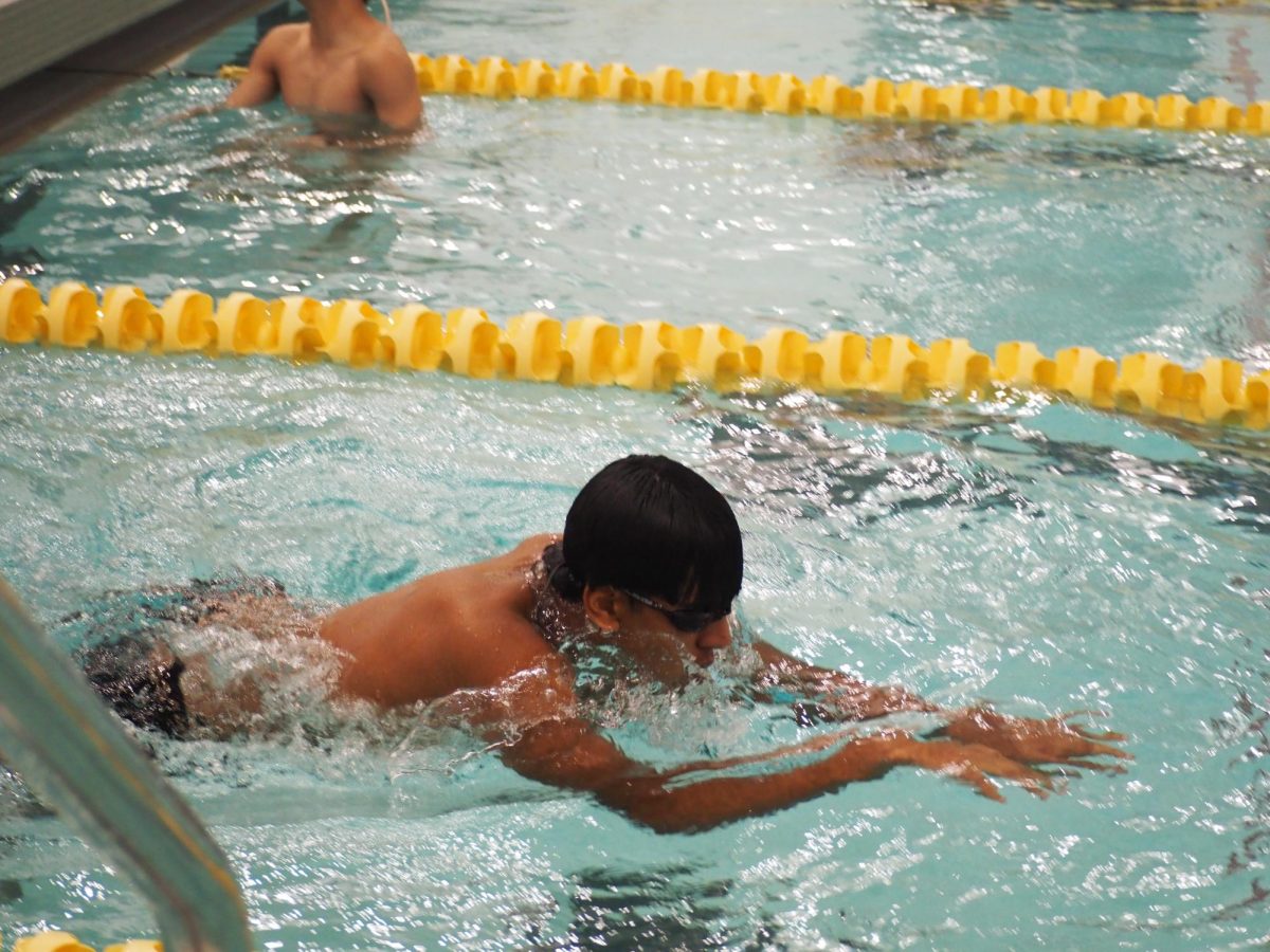 Aryan+Patel+practices+his+streamline+before+the+swim+meet+against+Rolling+Meadows+on+Friday%2C+December+8th.
